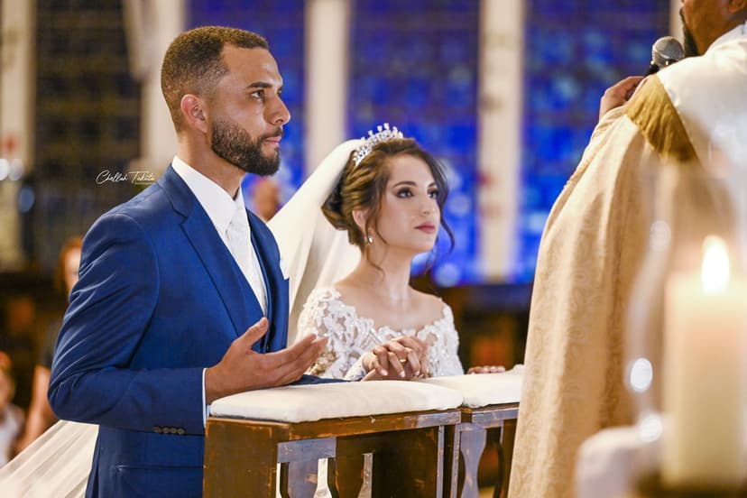 Couple listening attentively to officiant during wedding ceremony